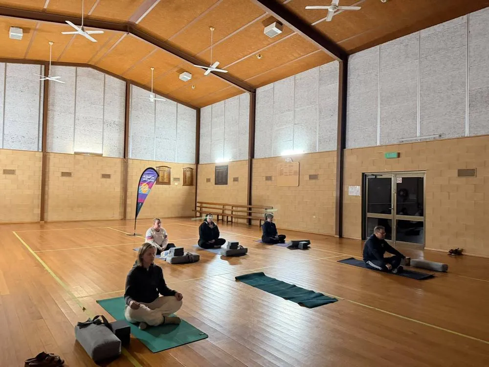 Group meditation during a community class